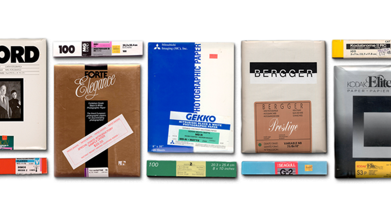 A grid of colorful packages of paper from different companies and decades.
