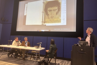 A speaker stands at a podium with an image of a suspect composite displayed on the screen.