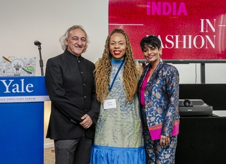 Anupam Sah, Charlotte Ashamu, and Lydia Buthello smile at the camera.