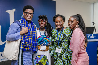 Four Yale Directors Forum fellows smile at the camera.